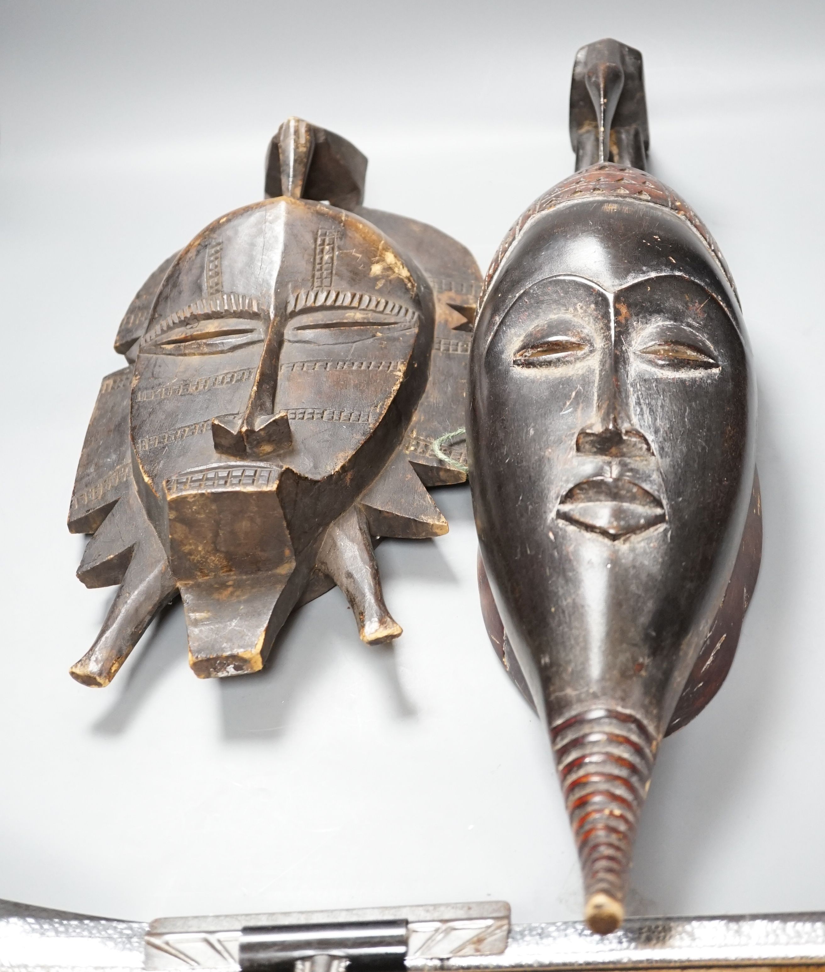 Two African carved wood masks; Senufo and Baule 65cm